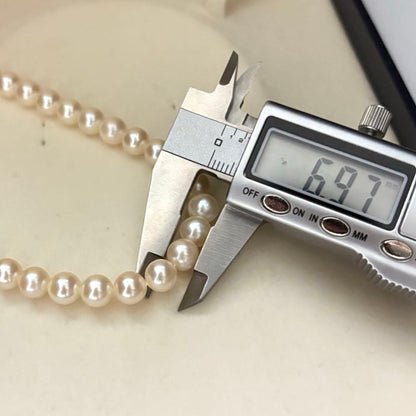 Akoya pearl necklace with 6.5-7.0mm round pearls in champagne gold color, 43cm length