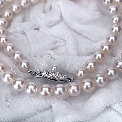 Tasaki Akoya pearl necklace featuring 6.5-7.0mm pearls with 43cm length on a white background