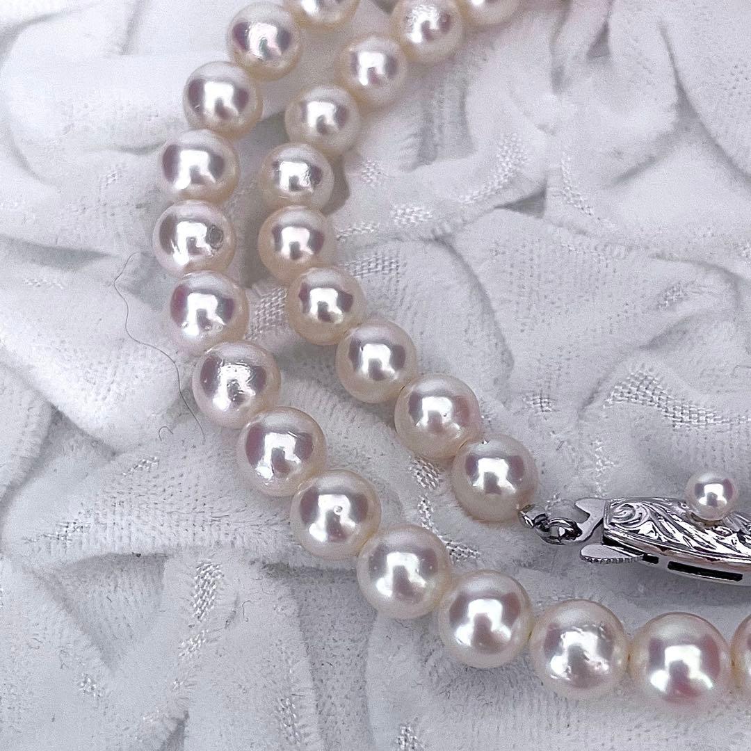 Tasaki Akoya pearl necklace featuring 6.5-7.0mm pearls with 43cm length on a white background