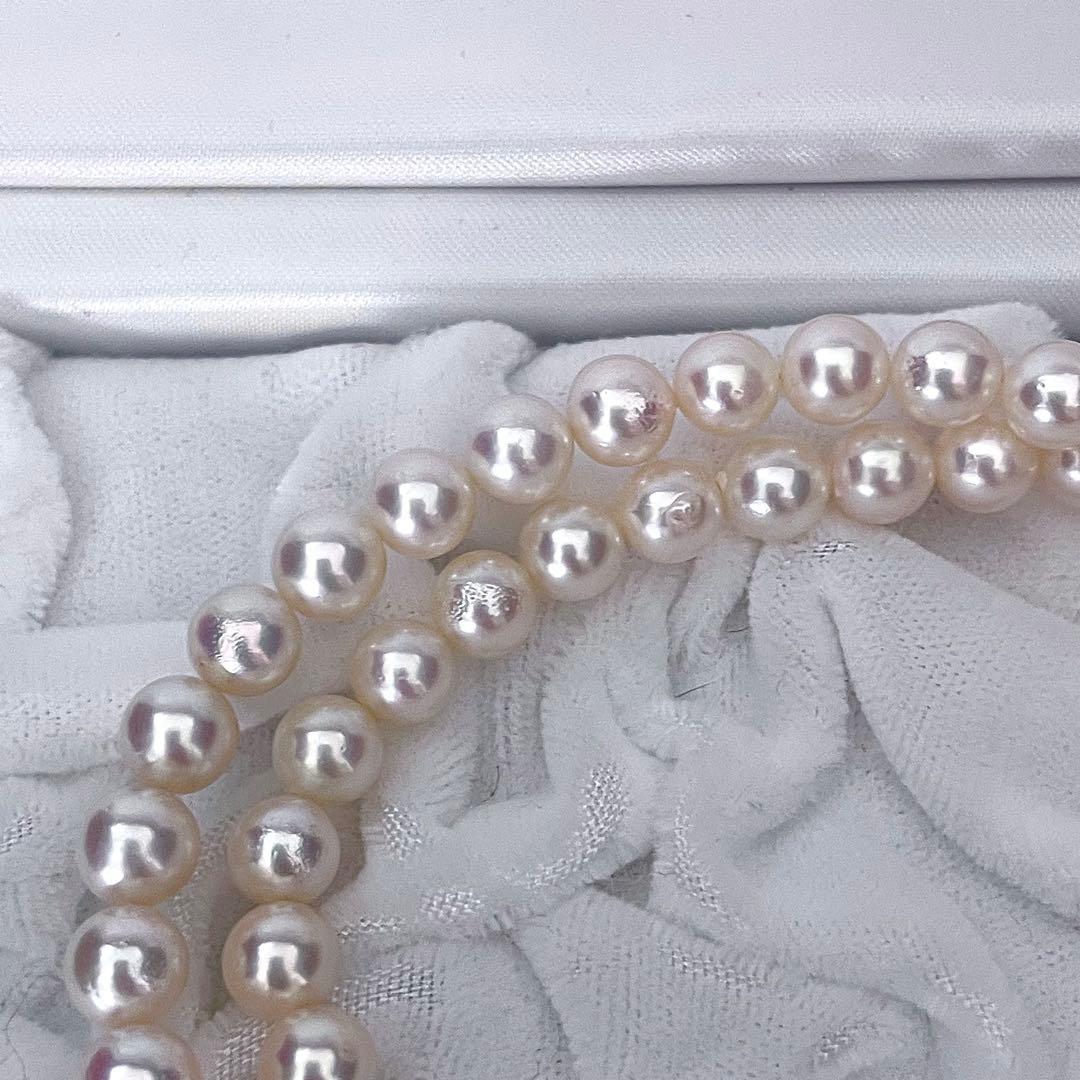 Tasaki Akoya pearl necklace featuring 6.5-7.0mm pearls with 43cm length on a white background