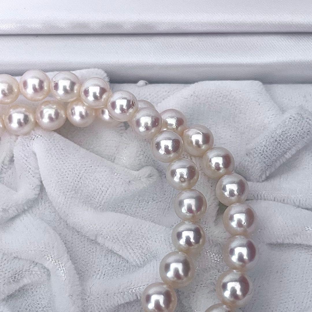 Tasaki Akoya pearl necklace featuring 6.5-7.0mm pearls with 43cm length on a white background