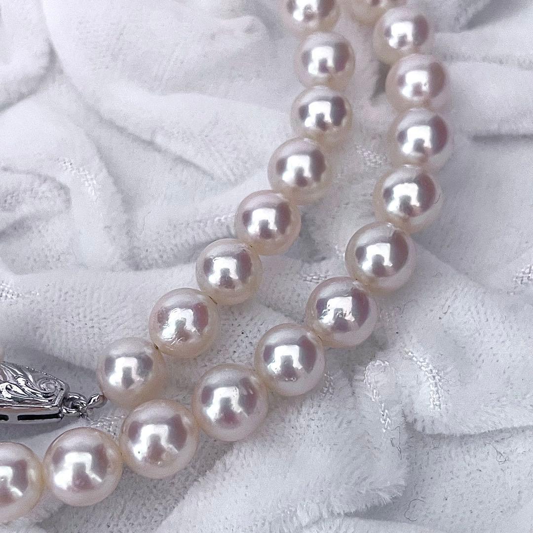 Tasaki Akoya pearl necklace featuring 6.5-7.0mm pearls with 43cm length on a white background