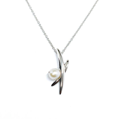 Tasaki pearl necklace with 5.6mm pearls on a 42cm silver chain weighing 3 grams