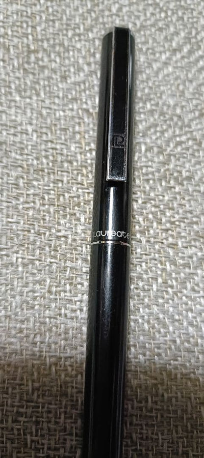 Pilot Laureate black and silver water-based ballpoint pen with cap on, showing light scratches and good condition