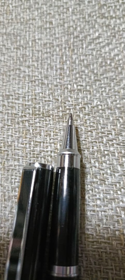 Pilot Laureate black and silver water-based ballpoint pen with cap on, showing light scratches and good condition