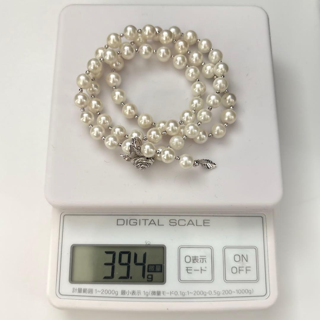 Akoya pearl necklace with white 7.5mm pearls and cliker closure on 57 cm chain