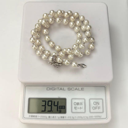 Akoya pearl necklace with white 7.5mm pearls and cliker closure on 57 cm chain