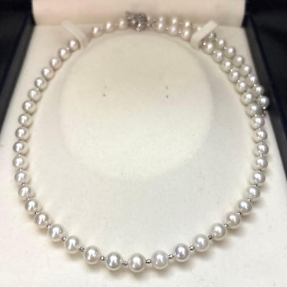Akoya pearl necklace with white 7.5mm pearls and cliker closure on 57 cm chain