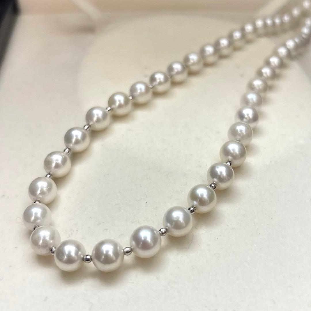 Akoya pearl necklace with white 7.5mm pearls and cliker closure on 57 cm chain