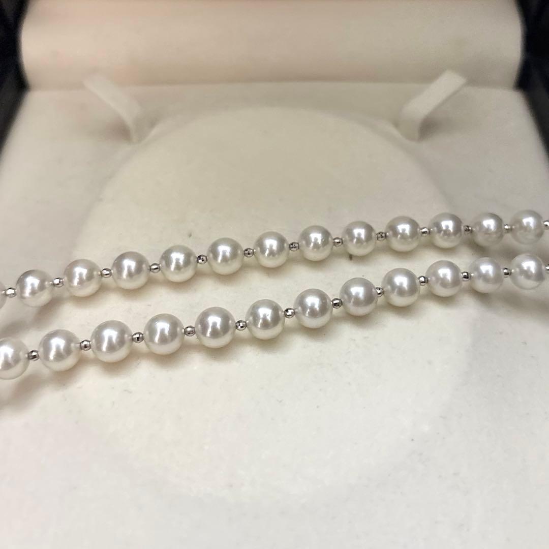 Akoya pearl necklace with white 7.5mm pearls and cliker closure on 57 cm chain