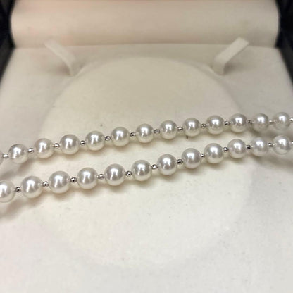 Akoya pearl necklace with white 7.5mm pearls and cliker closure on 57 cm chain