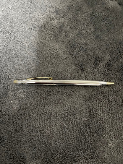 Silver CROSS metal ballpoint pen with clear body and sleek design