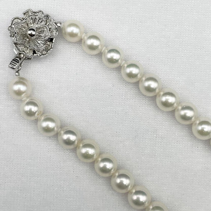 Akoya Hanadama pearl necklace with 7mm-6.5mm white pearls on a 43cm silver chain clasp