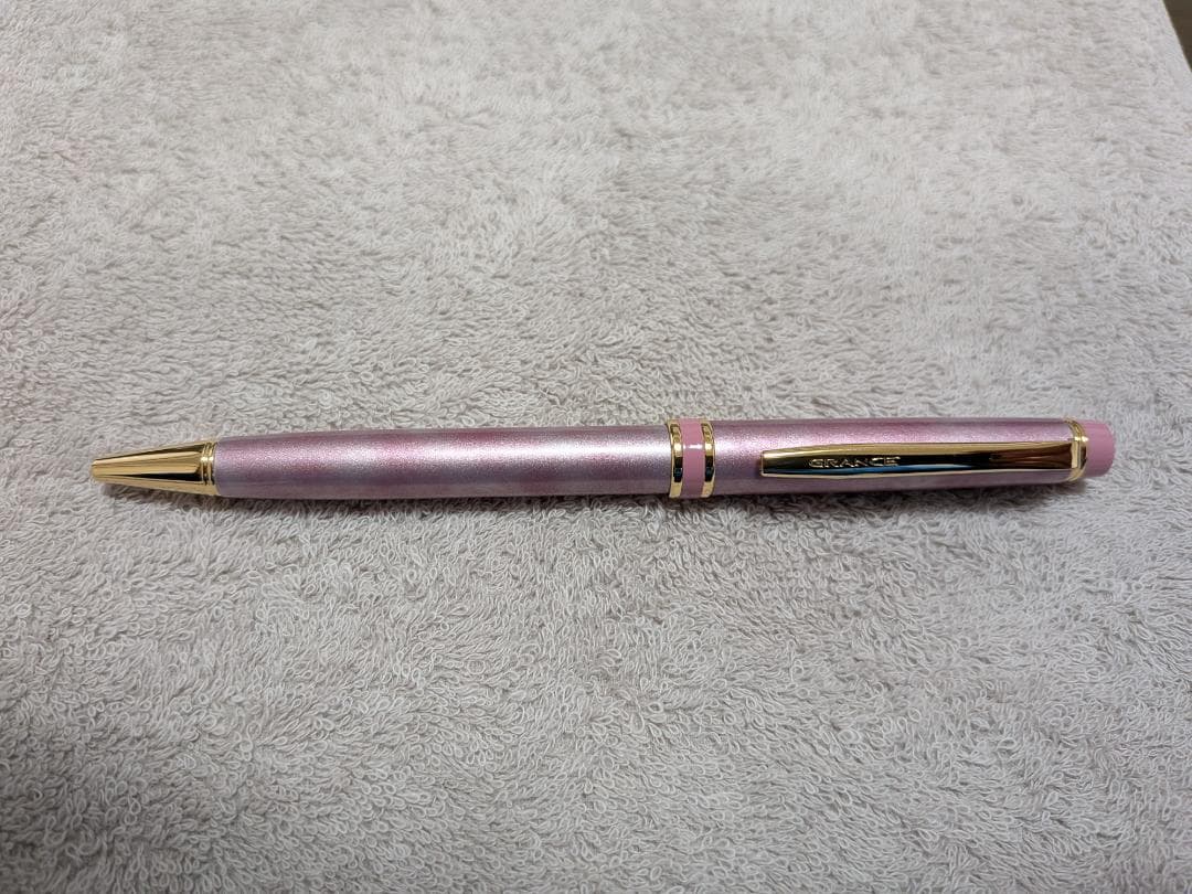 Pilot Grand Se Marble Pink ballpoint pen with gold accents and dedicated case on white background