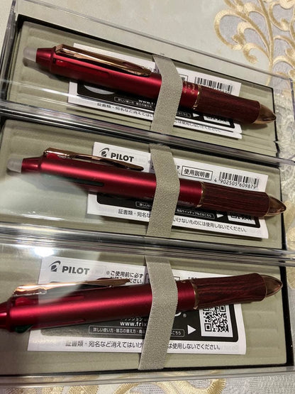Set of three Pilot ballpoint pens in black, red, and blue with a black carrying case
