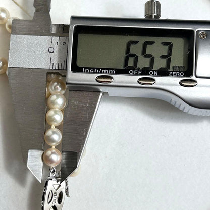 Two-strand Akoya pearl necklace with 7mm pearls, 59cm length, and sterling silver fittings
