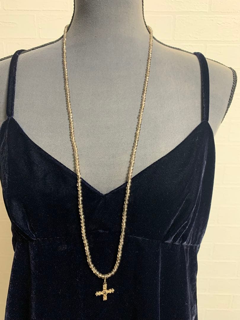 Light brown transparent smoky quartz necklace with gold cross pendant and silver top set