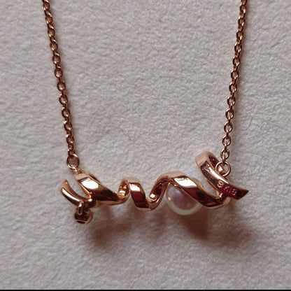 MIKIMOTOLOVE necklace featuring pink gold pearl and diamond with LOVE motif design