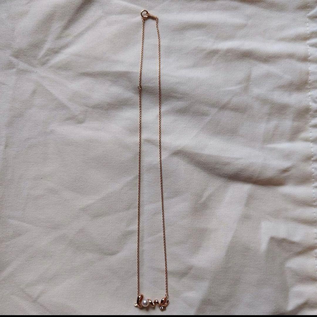 MIKIMOTOLOVE necklace featuring pink gold pearl and diamond with LOVE motif design