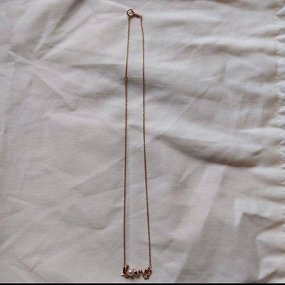 MIKIMOTOLOVE necklace featuring pink gold pearl and diamond with LOVE motif design