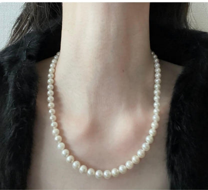 Akoya pearl necklace with 6.5-7mm pearls and matching 7mm pearl earrings set in K14 white gold