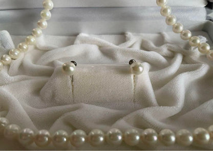 Akoya pearl necklace with 6.5-7mm pearls and matching 7mm pearl earrings set in K14 white gold