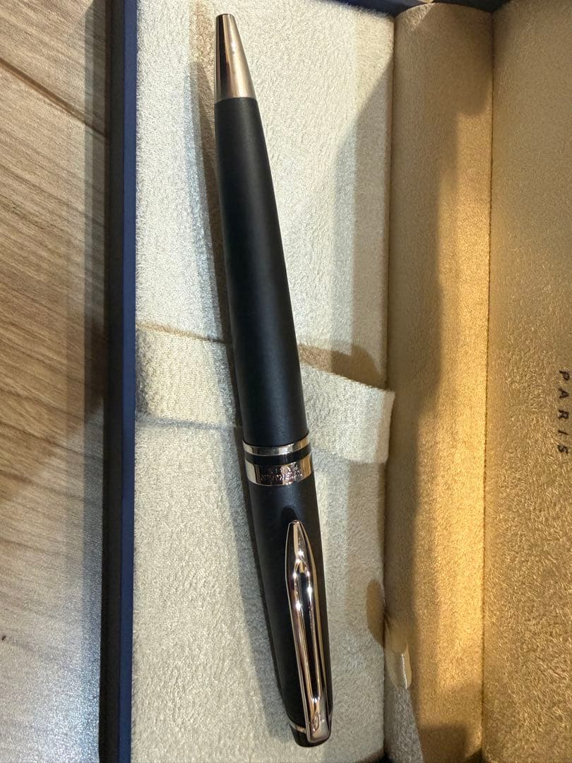 Waterman Expert Essential Matte Black CT ballpoint pen with matte finish and silver trim, shown with included paper bag