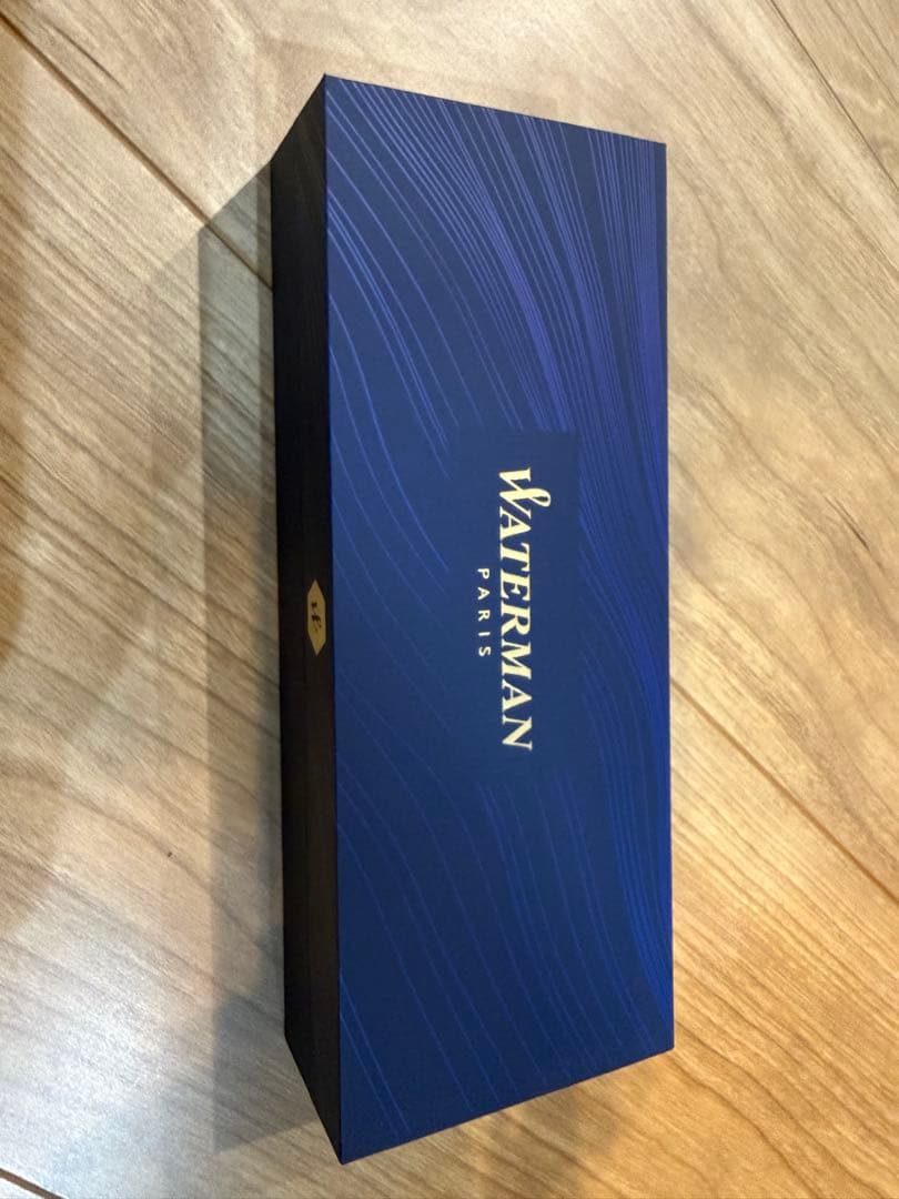 Waterman Expert Essential Matte Black CT ballpoint pen with matte finish and silver trim, shown with included paper bag