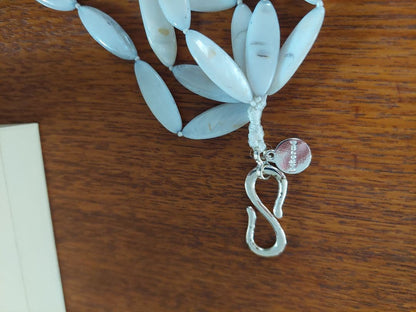 Close-up of a new Agate Shell Necklace featuring natural shell beads and elegant design