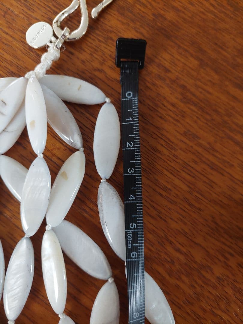 Close-up of a new Agate Shell Necklace featuring natural shell beads and elegant design