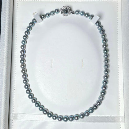 Akoya pearl necklace with 6.5-7.0mm round silver green pearls on a 41 cm silver chain marked SILVER