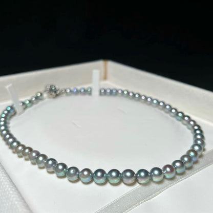 Akoya pearl necklace with 6.5-7.0mm round silver green pearls on a 41 cm silver chain marked SILVER