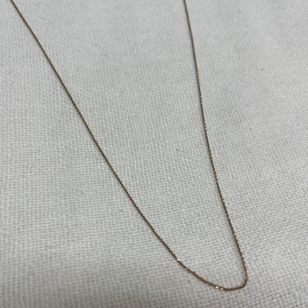 Agete necklace featuring a shell mark charm on a 41 cm chain displayed on white background
