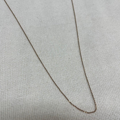 Agete necklace featuring a shell mark charm on a 41 cm chain displayed on white background