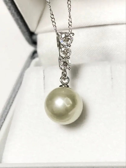 Akoya pearl pendant top with 9.5mm pearl and cubic zirconia set in silver