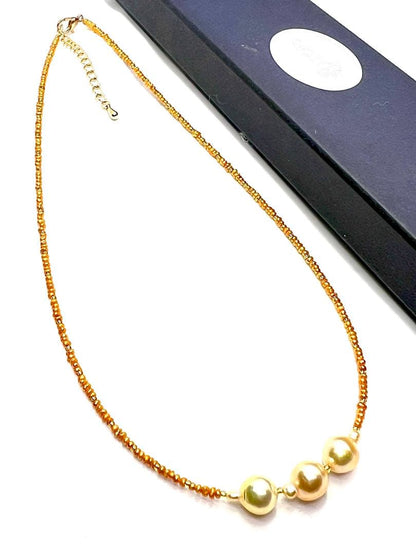 Gold Akoya pearl necklace with gold beads and baroque-shaped freshwater pearls on gold chain