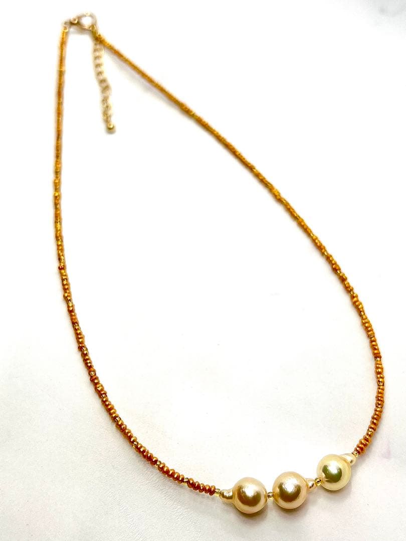 Gold Akoya pearl necklace with gold beads and baroque-shaped freshwater pearls on gold chain