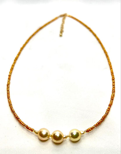 Gold Akoya pearl necklace with gold beads and baroque-shaped freshwater pearls on gold chain