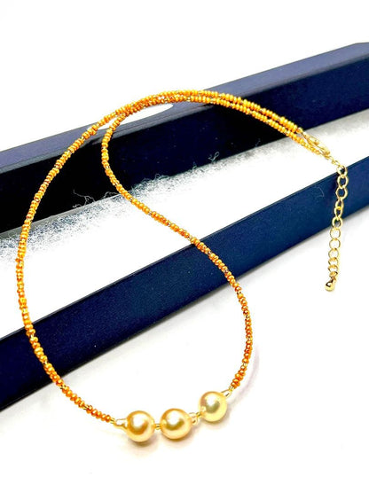 Gold Akoya pearl necklace with gold beads and baroque-shaped freshwater pearls on gold chain