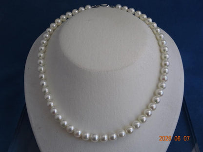 Akoya pearl necklace featuring almost round 7.5-8mm white, pink, blue, and cream pearls with silver clasp