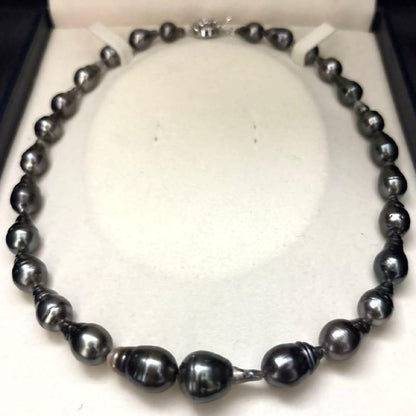 Aurora black-lipped pearl necklace with round peacock green Akoya pearls measuring 8.6-12.6mm on 43 cm silver chain