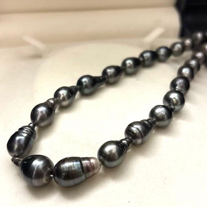 Aurora black-lipped pearl necklace with round peacock green Akoya pearls measuring 8.6-12.6mm on 43 cm silver chain