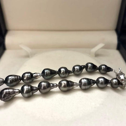 Aurora black-lipped pearl necklace with round peacock green Akoya pearls measuring 8.6-12.6mm on 43 cm silver chain