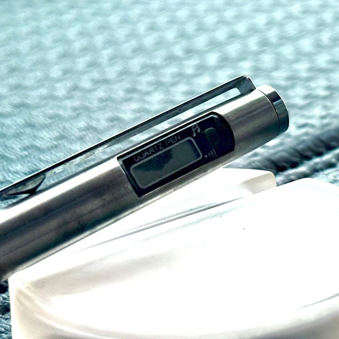 Pilot Quartz Pen in two colors with multi-function features and an included watch showing signs of wear