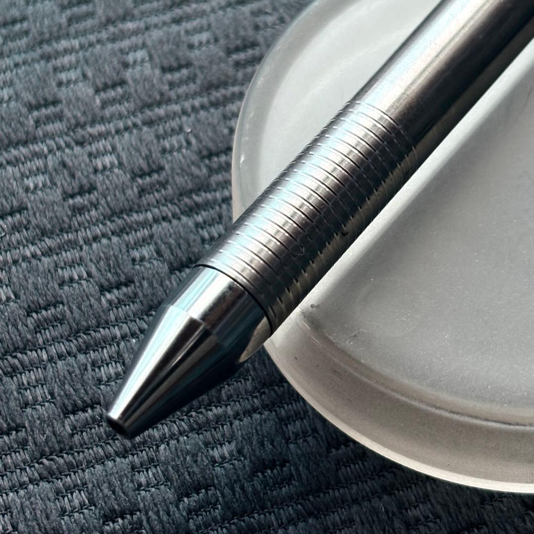 Pilot Quartz Pen in two colors with multi-function features and an included watch showing signs of wear