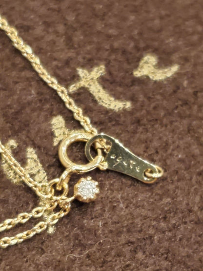 agete gold necklace featuring a 0.03 carat diamond pendant on a delicate chain