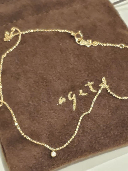 agete gold necklace featuring a 0.03 carat diamond pendant on a delicate chain