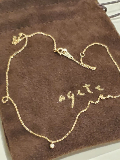 agete gold necklace featuring a 0.03 carat diamond pendant on a delicate chain