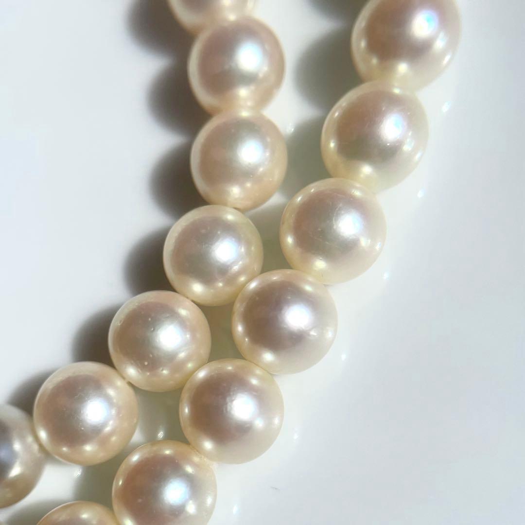 Akoya pearl necklace with 7.5-8mm white pearls and silver clasp displayed on a white background