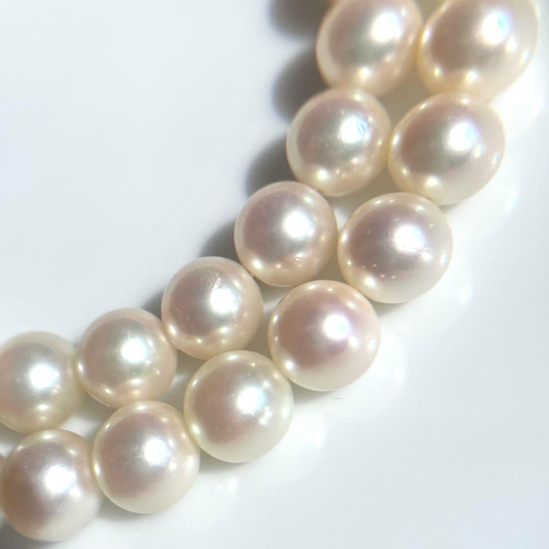 Akoya pearl necklace with 7.5-8mm white pearls and silver clasp displayed on a white background